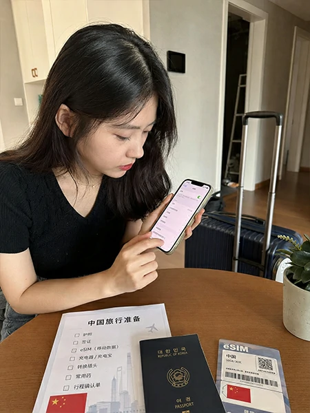 Traveler setting up eSIM mobile internet and phone access before a trip to China