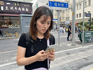 Visitor checking a phone map while confused about addresses metro exits taxis and local routes