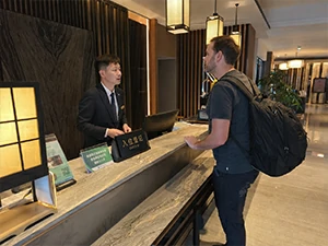 Visitor needing practical help with hotel tickets routes payment addresses and local bookings